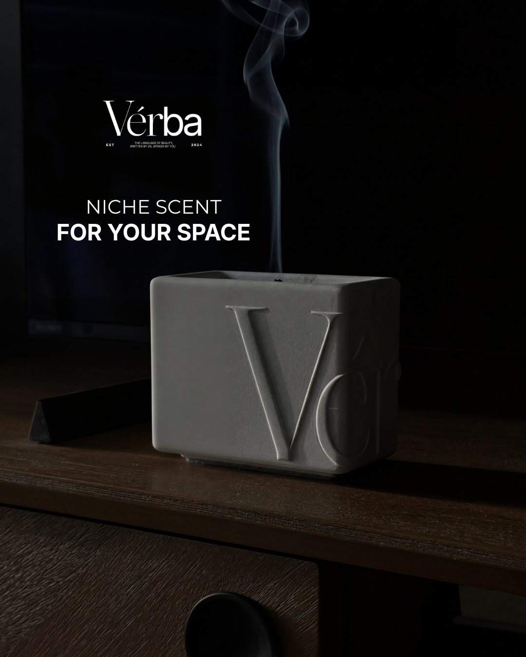 White container Verba niche scented candle on dark wood cabinet
