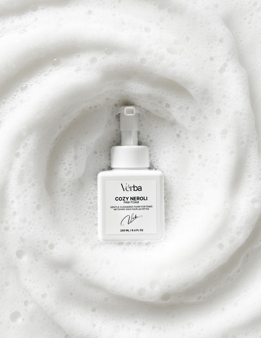 Verba Cozy Neroli perfumed paw foam on a white background with swirling foam