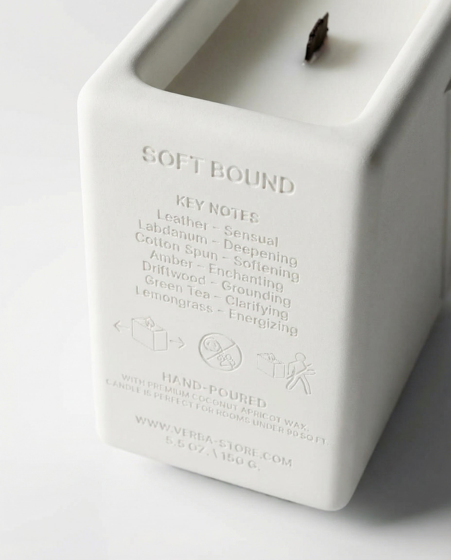 Engaving close up to key notes of Niche scented wooden wick premium Soft Bound candle – Verba Toronto