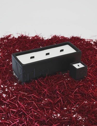 Large black Verba candle placed on vibrant red saffron threads — Unleashed Saffron fragrance video.